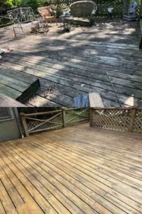 Residential deck power washing and sealing for clean and protected wood surface